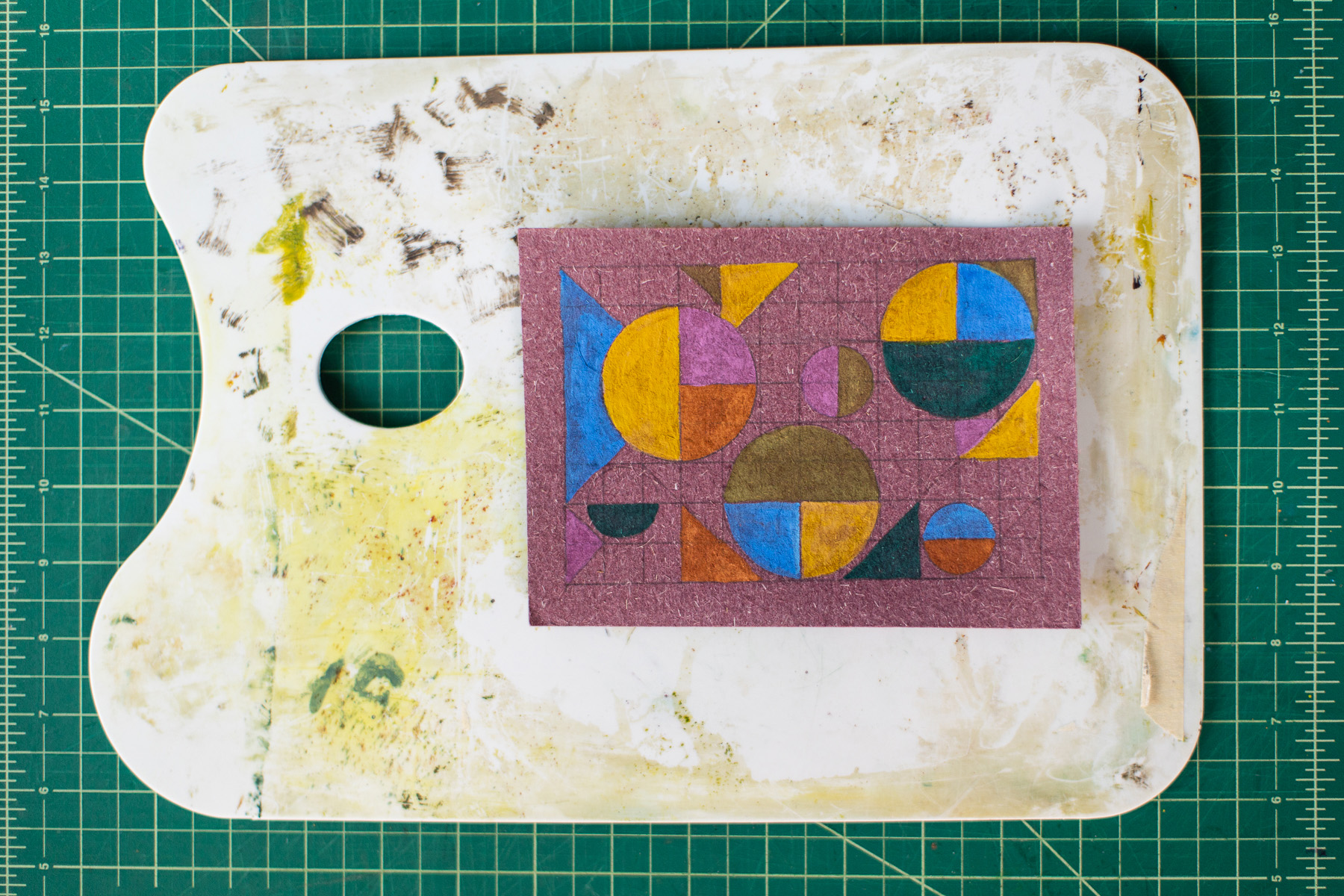 guache geometric paining on purple paper