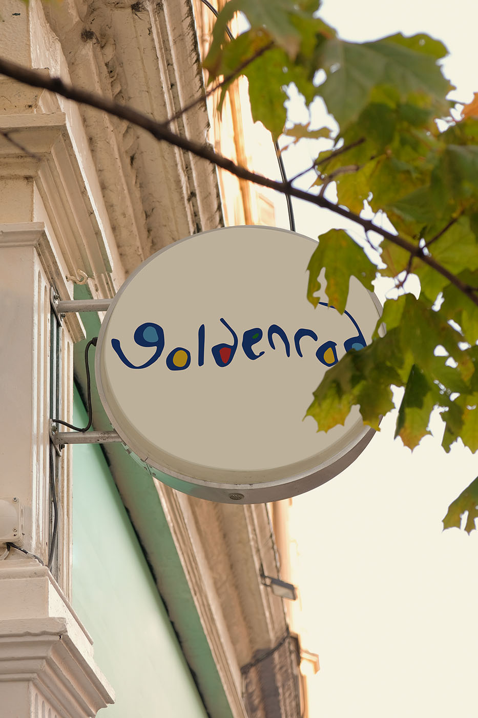 circular external building sign with "goldenrod"